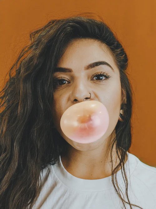Woman inflating the bubble gum in pregnancy is it a safe