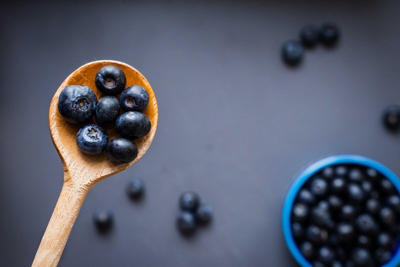 Blue Berries in wooden spoon for pregnancy