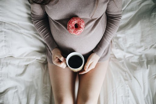 Doughnut and deserts in Pregnancy on the belly
