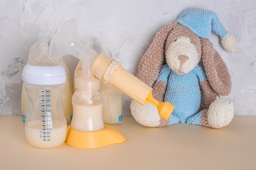 Breast milk pumped and stored next to a knitted doll