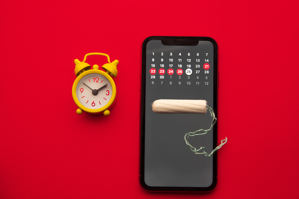 Mobile calender, clock and a tampon - Period tracking